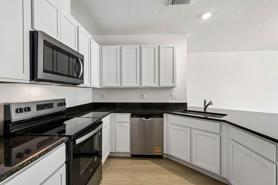 Furnished interior view inside a new home in Reserve at Forest Lake Townhomes, Lake Wales (Image 6).
