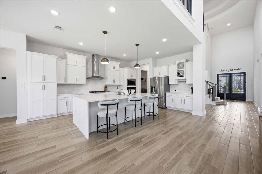 A chef-inspired kitchen featuring an oversized island, premium finishes, abundant storage, and effortless functionality.