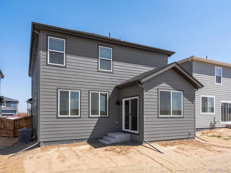 Front exterior of a new home in Lake Bluff, Greeley, CO, highlighting curb appeal (Image 2). Front exterior of a new home in Lake Bluff, Greeley, CO, highlighting curb appeal (Image 2).