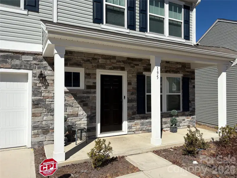 Exterior details and patio area of a home in Hidden Lakes, Statesville (Image 3).