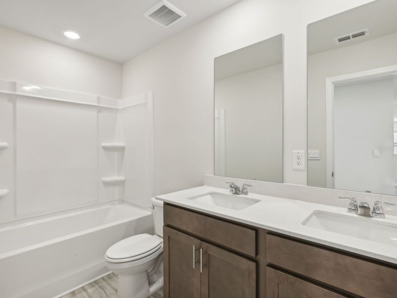 Furnished interior view inside a new home in Northwoods at Mirror Lake, Villa Rica (Image 9).