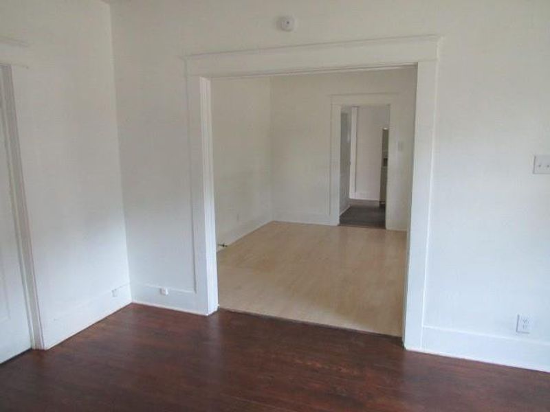 Empty room featuring wood finished floors Empty room featuring wood finished floors