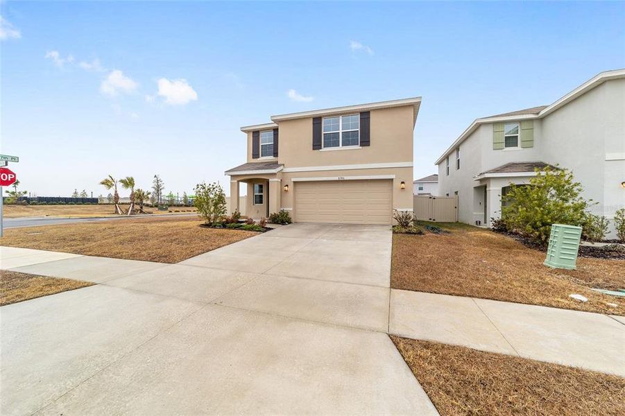 Front exterior of a new home in Ocala Crossings South, Ocala, FL, highlighting curb appeal (Image 25). Front exterior of a new home in Ocala Crossings South, Ocala, FL, highlighting curb appeal (Image 25).