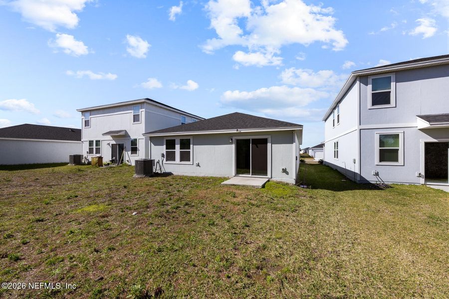 Exterior details and patio area of a home in Lakes at Bella Lago – Classic Series, Green Cove Springs (Image 3).