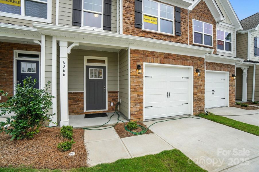 Front exterior of a new home in Harrisburg Village Townhomes, Harrisburg, NC, highlighting curb appeal (Image 24). Front exterior of a new home in Harrisburg Village Townhomes, Harrisburg, NC, highlighting curb appeal (Image 24).