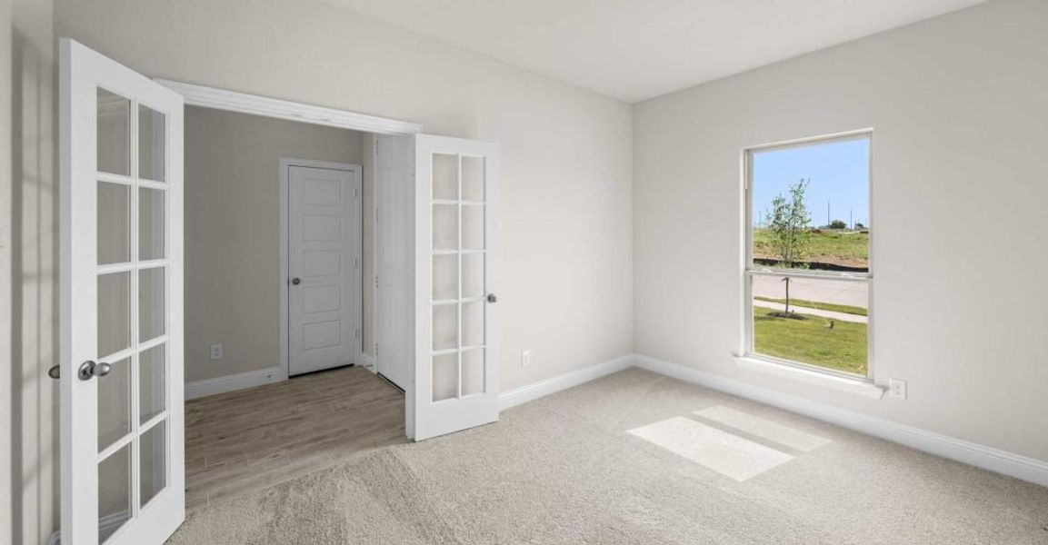 Representative exterior photo of a completed home built from the Alderbury by Impression Homes in Timberbrook, Justin, TX (Image 13).