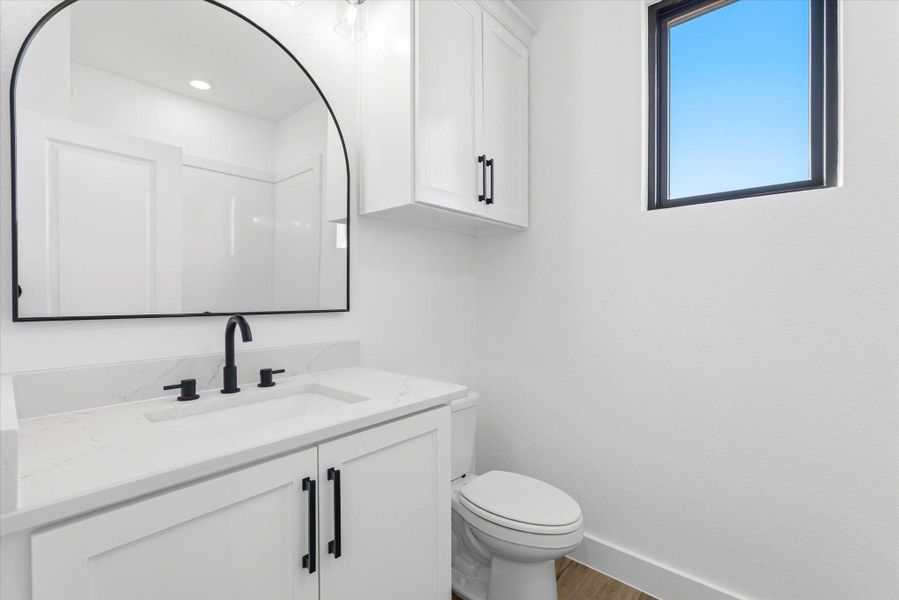 The upstairs third full bath offers a convenient shower-tub combo.