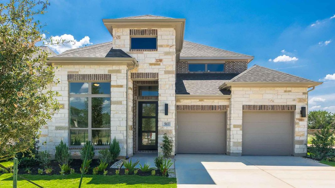French provincial home featuring stone siding, roof with shingles, driveway, and an attached garage French provincial home featuring stone siding, roof with shingles, driveway, and an attached garage
