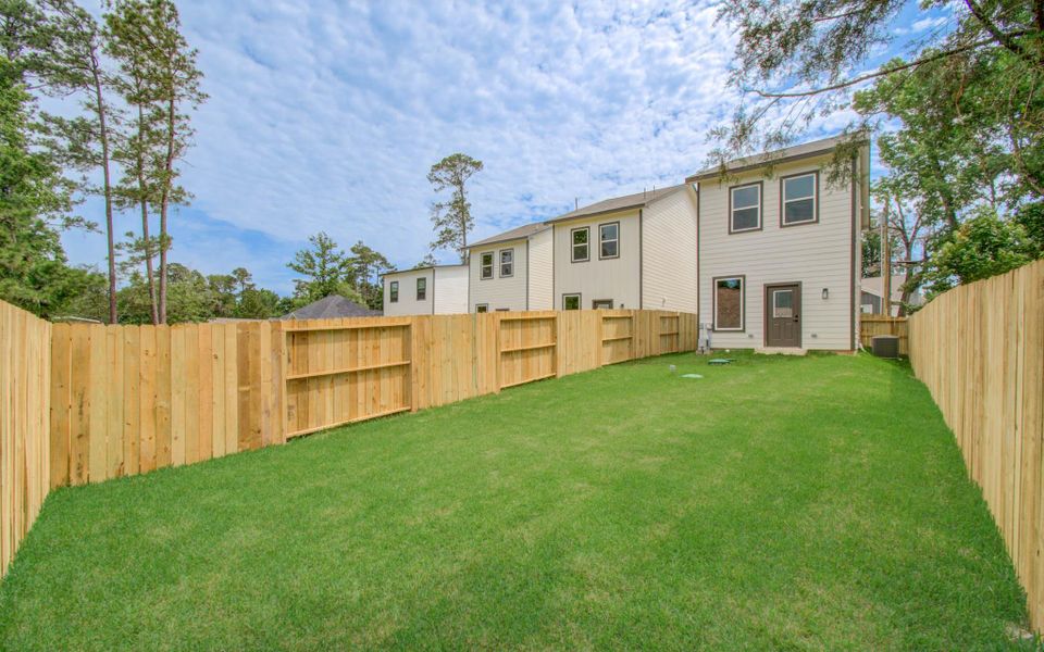 Exterior details and patio area of a home in Arrowhead Lakes, Willis (Image 4). Exterior details and patio area of a home in Arrowhead Lakes, Willis (Image 4).