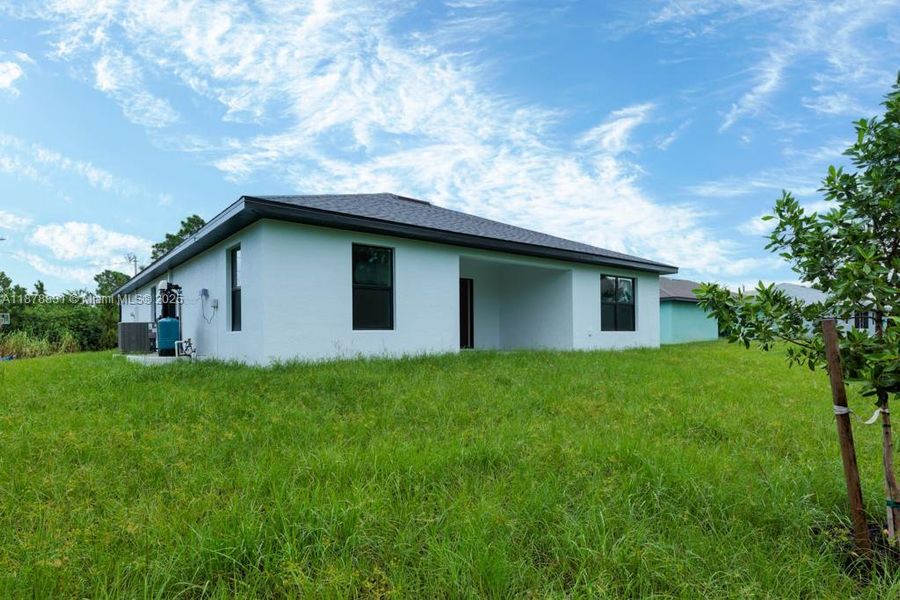 Front exterior of a new home in , Lehigh Acres, FL, highlighting curb appeal (Image 1). Front exterior of a new home in , Lehigh Acres, FL, highlighting curb appeal (Image 1).