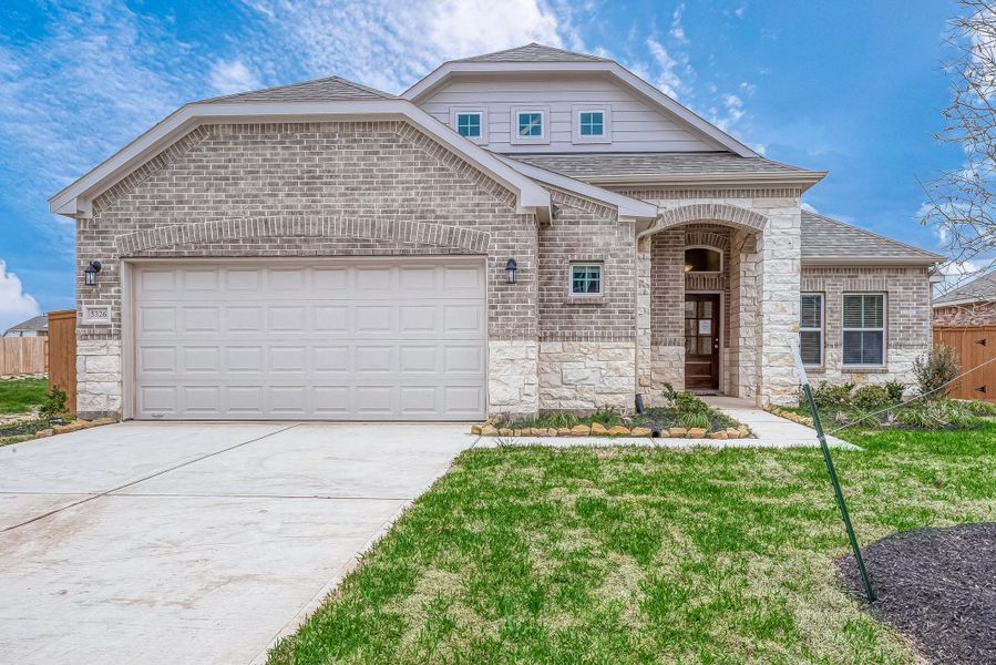 Representative exterior photo of a completed home built from the Floor Plan 1830 by Colina Homes in Grand Magnolia, Magnolia, TX (Image 29). Representative exterior photo of a completed home built from the Floor Plan 1830 by Colina Homes in Grand Magnolia, Magnolia, TX (Image 29).
