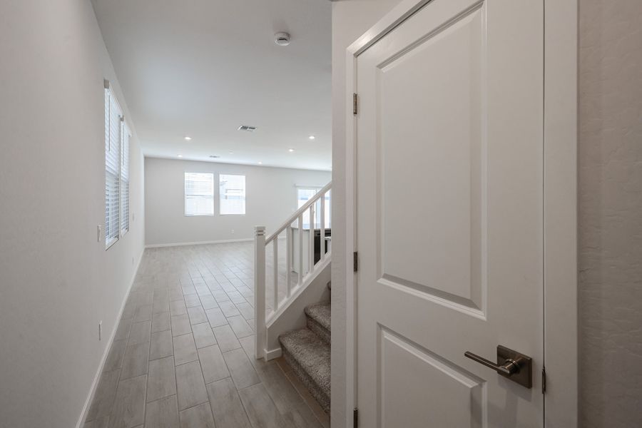 A hallway with white doors. A hallway with white doors.