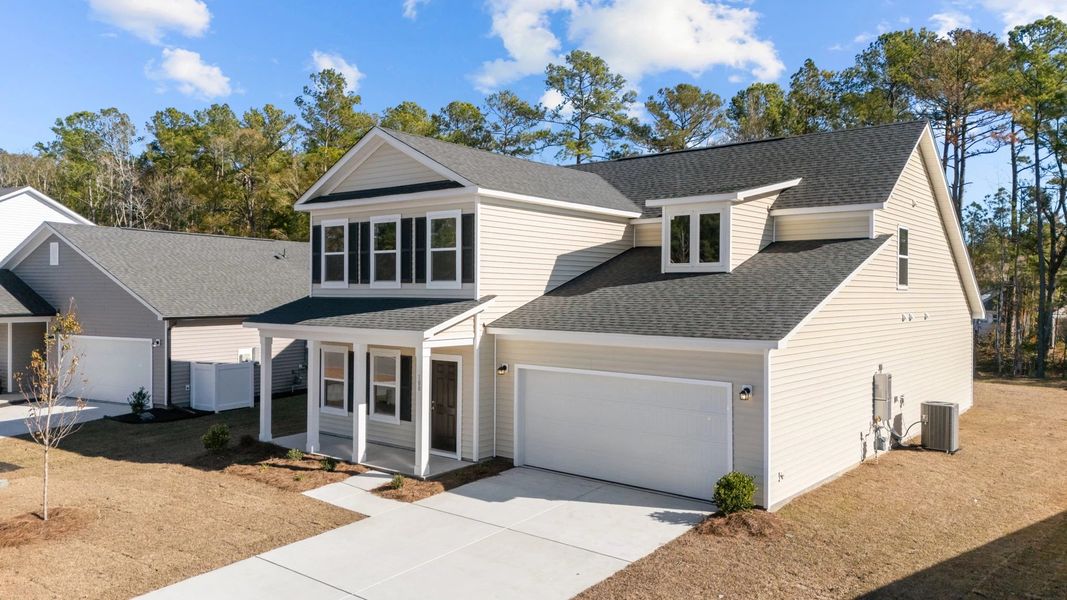 Front exterior of a new home in Trieste at Bella Vita, Myrtle Beach, SC, highlighting curb appeal (Image 2). Front exterior of a new home in Trieste at Bella Vita, Myrtle Beach, SC, highlighting curb appeal (Image 2).