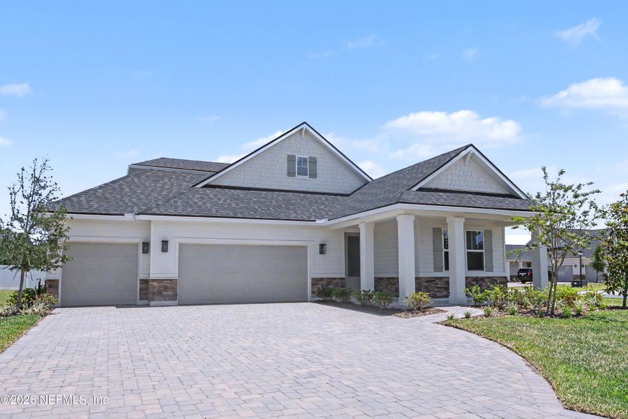 Front exterior of a new home in Brookestone, St. Augustine, FL, highlighting curb appeal (Image 23). Front exterior of a new home in Brookestone, St. Augustine, FL, highlighting curb appeal (Image 23).
