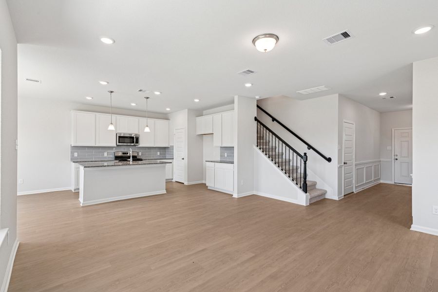 The Oriole II- Family Room into Kitchen The Oriole II- Family Room into Kitchen