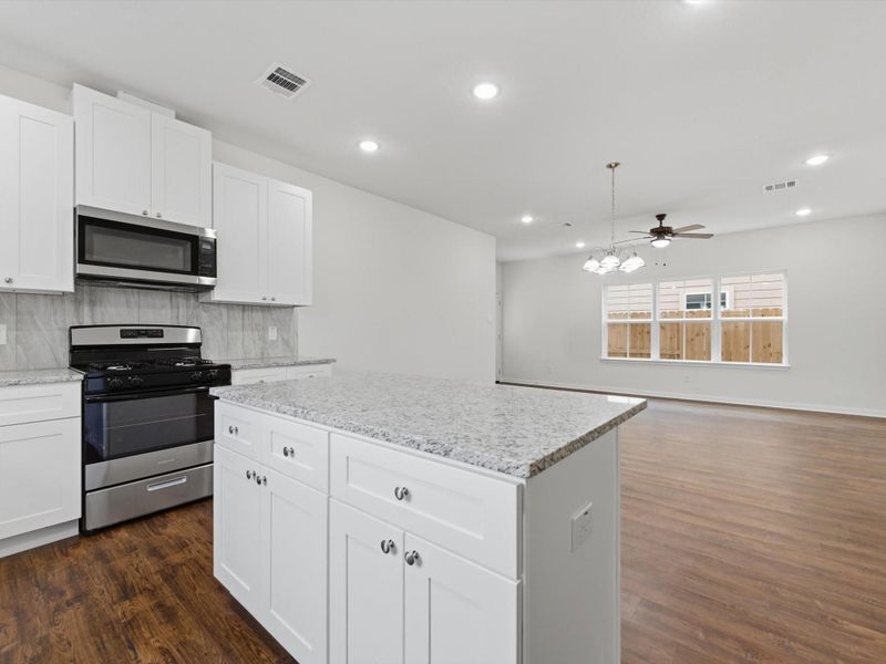 The seamless flow from the kitchen to the living space keeps everyone connected and makes entertaining effortless.