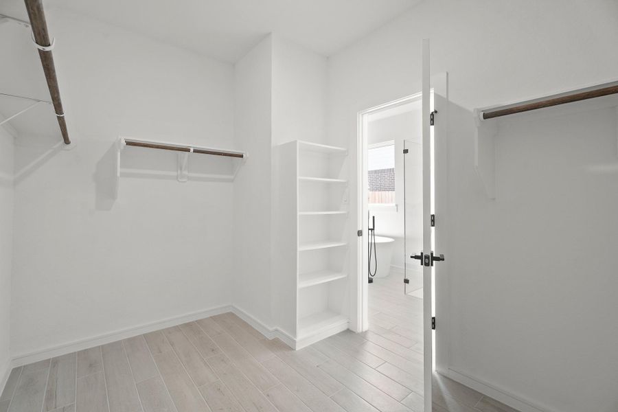Primary walk-in closet (*Photo not of actual home and used for illustration purposes only.) Primary walk-in closet (*Photo not of actual home and used for illustration purposes only.)