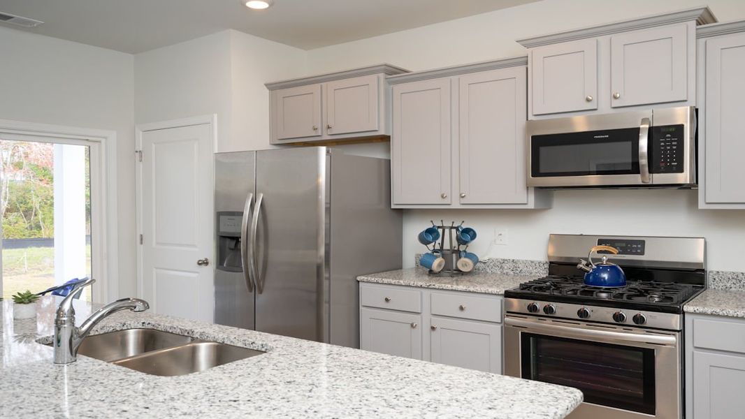 Representative furnished interior of a home built from the KERRY by D.R. Horton in Lochaven, Conway (Image 24).