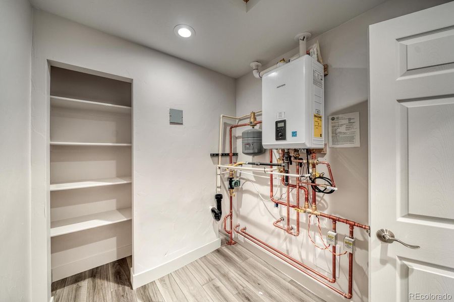 Laundry room with tankless water system Laundry room with tankless water system