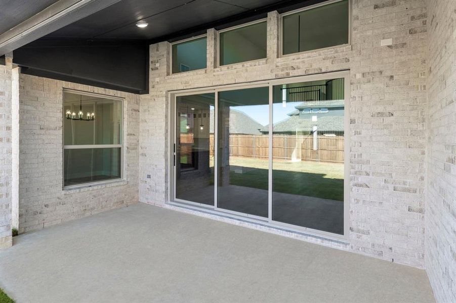 Exterior details and patio area of a home in Valencia on The Lake, Little Elm (Image 3).