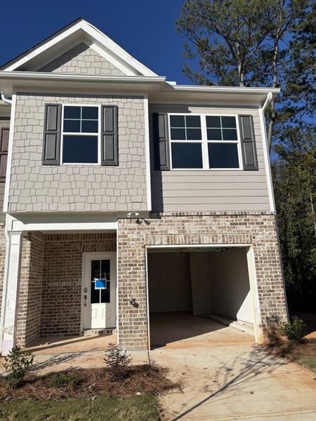 Exterior details and patio area of a home in The Reserve At Clock Tower, Douglasville (Image 1). Exterior details and patio area of a home in The Reserve At Clock Tower, Douglasville (Image 1).