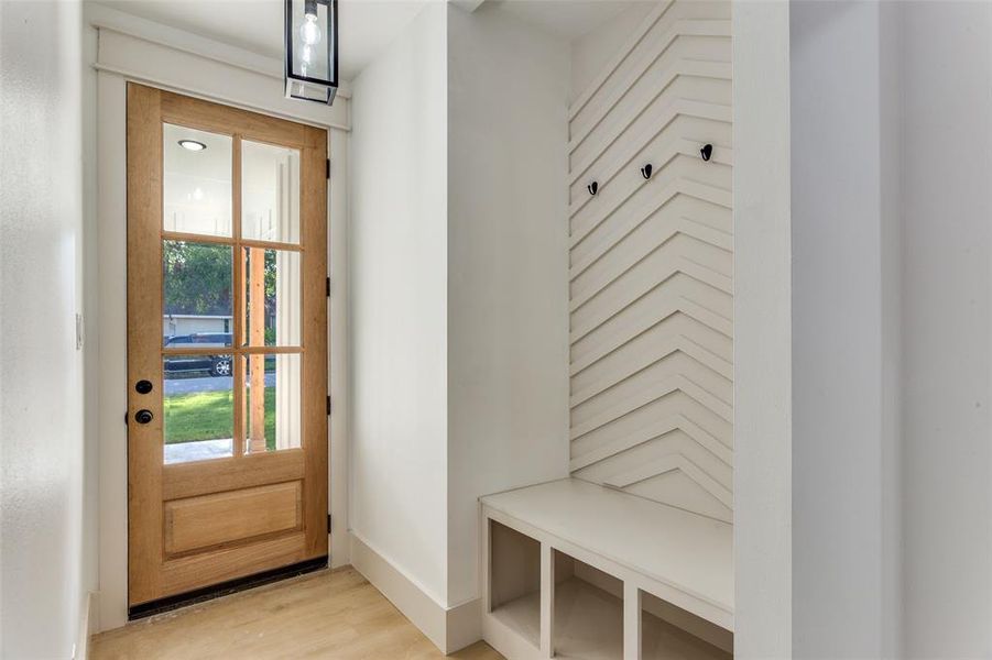 Mudroom with light wood-style flooring and baseboards Mudroom with light wood-style flooring and baseboards