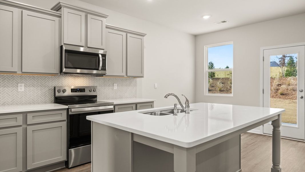 Representative furnished interior of a home built from the ANSLEY Express by D.R. Horton in WillowBrook, Winder (Image 7).