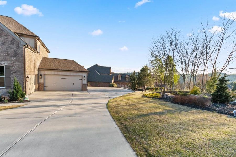 Front exterior of a new home in , Flowery Branch, GA, highlighting curb appeal (Image 30).