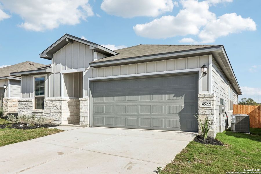 Front exterior of a new home in Remington Ranch, San Antonio, TX, highlighting curb appeal (Image 1). Front exterior of a new home in Remington Ranch, San Antonio, TX, highlighting curb appeal (Image 1).