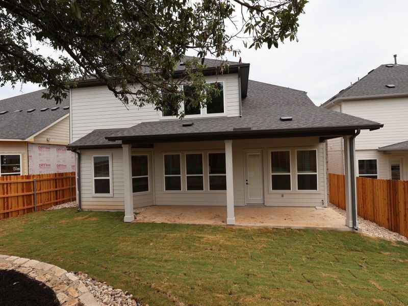 Front exterior of a new home in Edgewood, Leander, TX, highlighting curb appeal (Image 2).