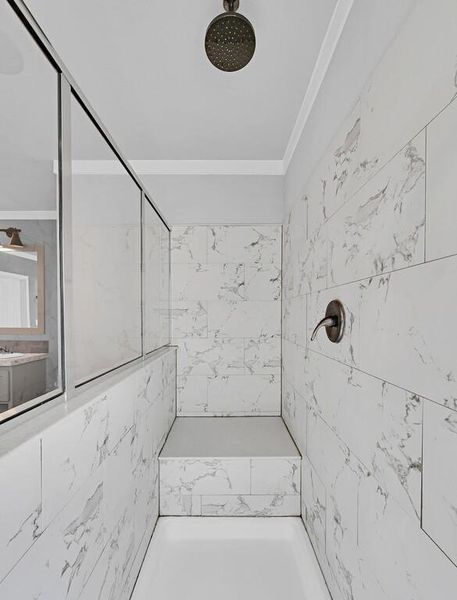Bathroom featuring a marble finish shower Bathroom featuring a marble finish shower