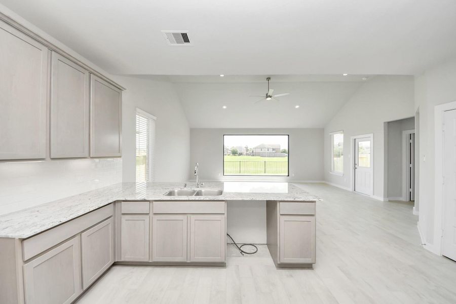 All of this overlooks your expansive family room, creating a perfect space for culinary delights and family gatherings. All of this overlooks your expansive family room, creating a perfect space for culinary delights and family gatherings.