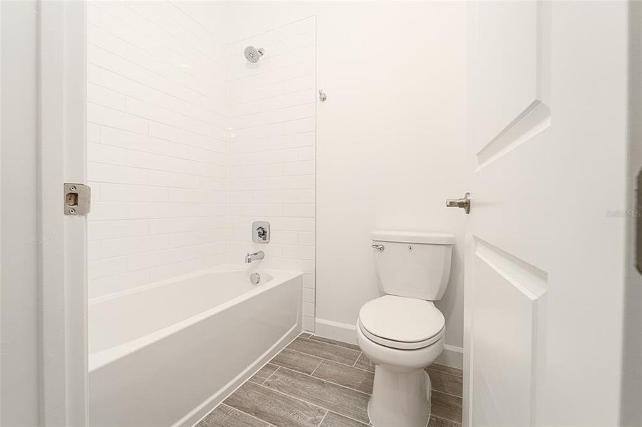 Furnished interior view inside a new home in Tesoro Club, Port St. Lucie (Image 10).