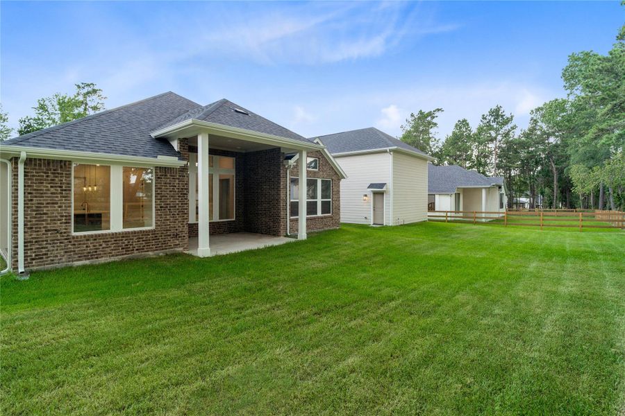 Exterior details and patio area of a home in Timber Hollow, Magnolia (Image 29).