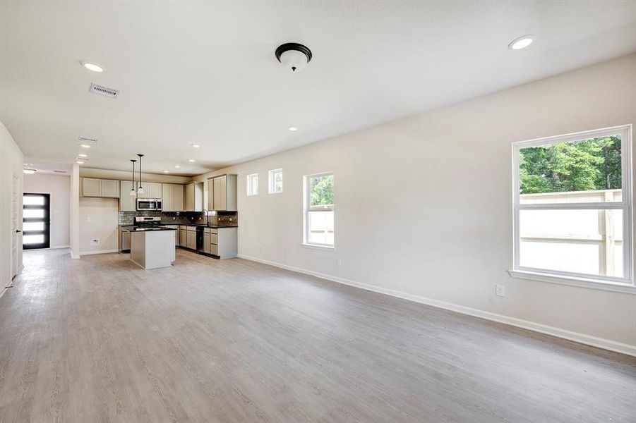 The Davenport II- Family Room into Dining Area and Kitchen