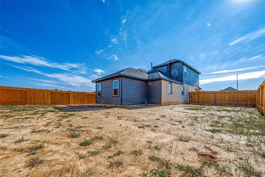 Exterior details and patio area of a home in Mill Creek Trails, Magnolia (Image 2).