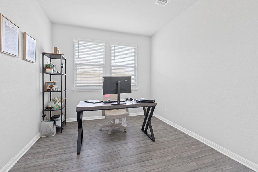 Office featuring baseboards and wood finished floors Office featuring baseboards and wood finished floors