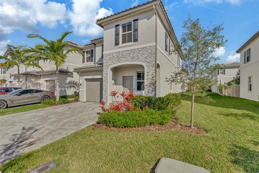 Front exterior of a new home in , Coral Springs, FL, highlighting curb appeal (Image 27).