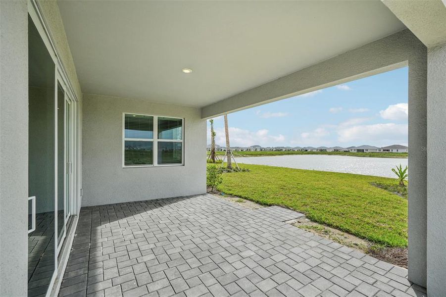 Exterior details and patio area of a home in Crescent Lakes - Signature Series, Punta Gorda (Image 20).