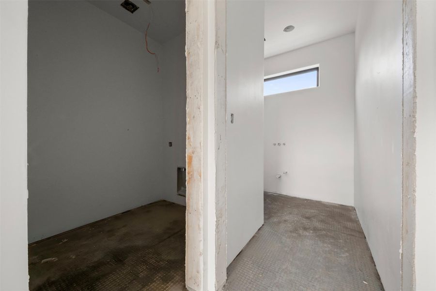 Utility room and full bath just off the garage.
