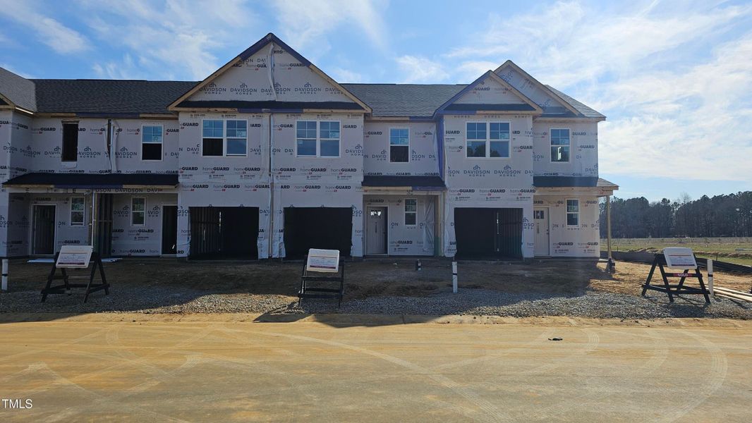 Front exterior of a new home in Springvale, Fuquay Varina, NC, highlighting curb appeal (Image 44).