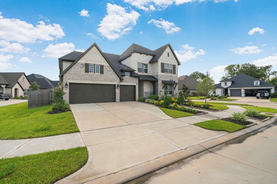 Front exterior of a new home in , Missouri City, TX, highlighting curb appeal (Image 2). Front exterior of a new home in , Missouri City, TX, highlighting curb appeal (Image 2).
