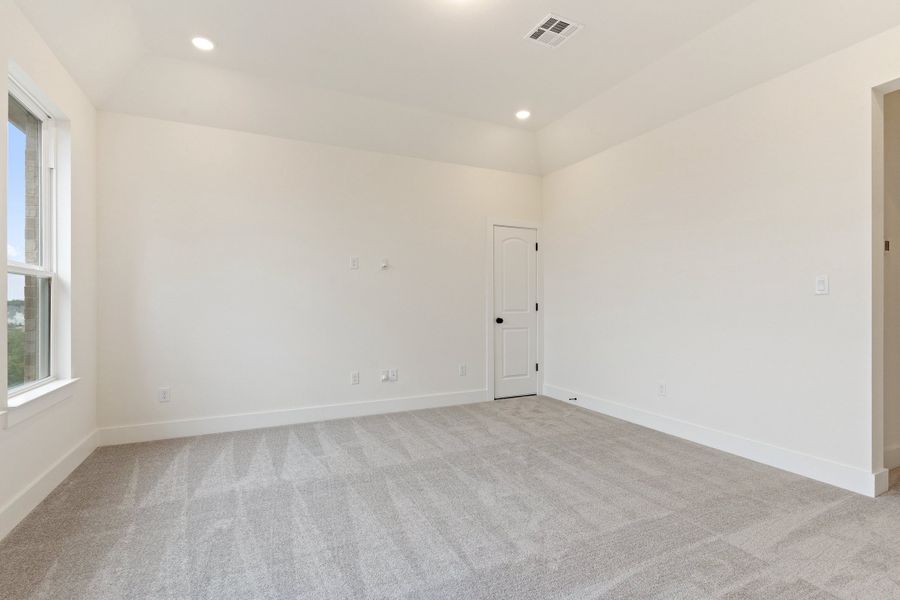 Representative unfurnished interior of a home built from the Waterville by Ashton Woods in The Trails at Carmel, Pflugerville (Image 52).