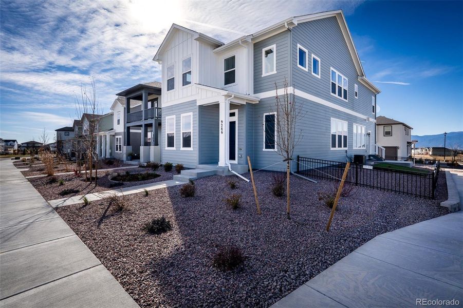 Front exterior of a new home in Revel Crossing at Wolf Ranch – The Outlook Collection, Colorado Springs, CO, highlighting curb appeal (Image 25).
