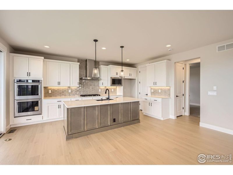 Furnished interior view inside a new home in RainDance, Windsor (Image 7).