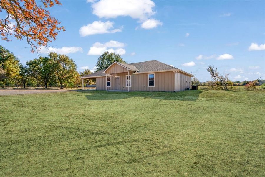 Exterior details and patio area of a home in , Powderly (Image 13).