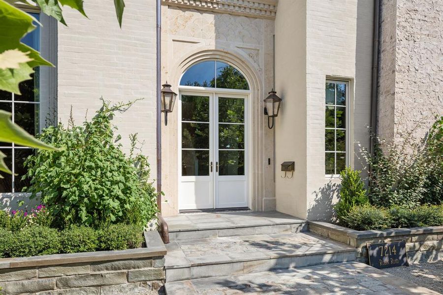Property entrance featuring french doors