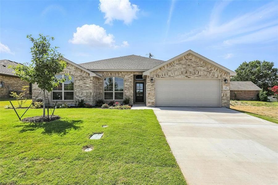 Front exterior of a new home in Trail Creek, Cleburne, TX, highlighting curb appeal (Image 20).