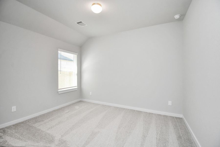 Generously sized secondary bedrooms featuring spacious closets, soft and inviting carpeting underfoot, large windows allowing plenty of natural light, and the added touch of privacy blinds for your personal retreat. Sample photo of completed home with similar floor plan. Actual colors and selections may vary.