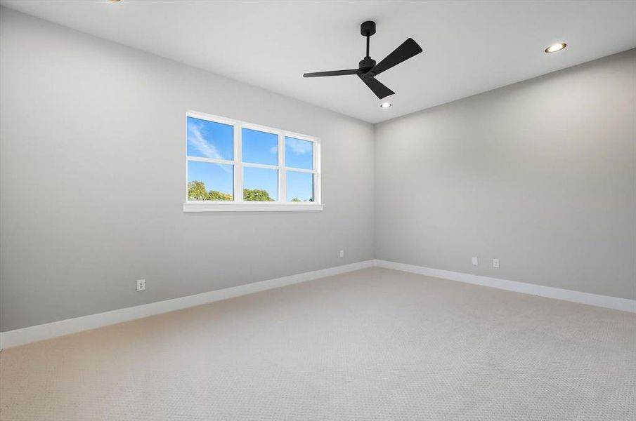 Carpeted spare room featuring ceiling fan and recessed lighting Carpeted spare room featuring ceiling fan and recessed lighting